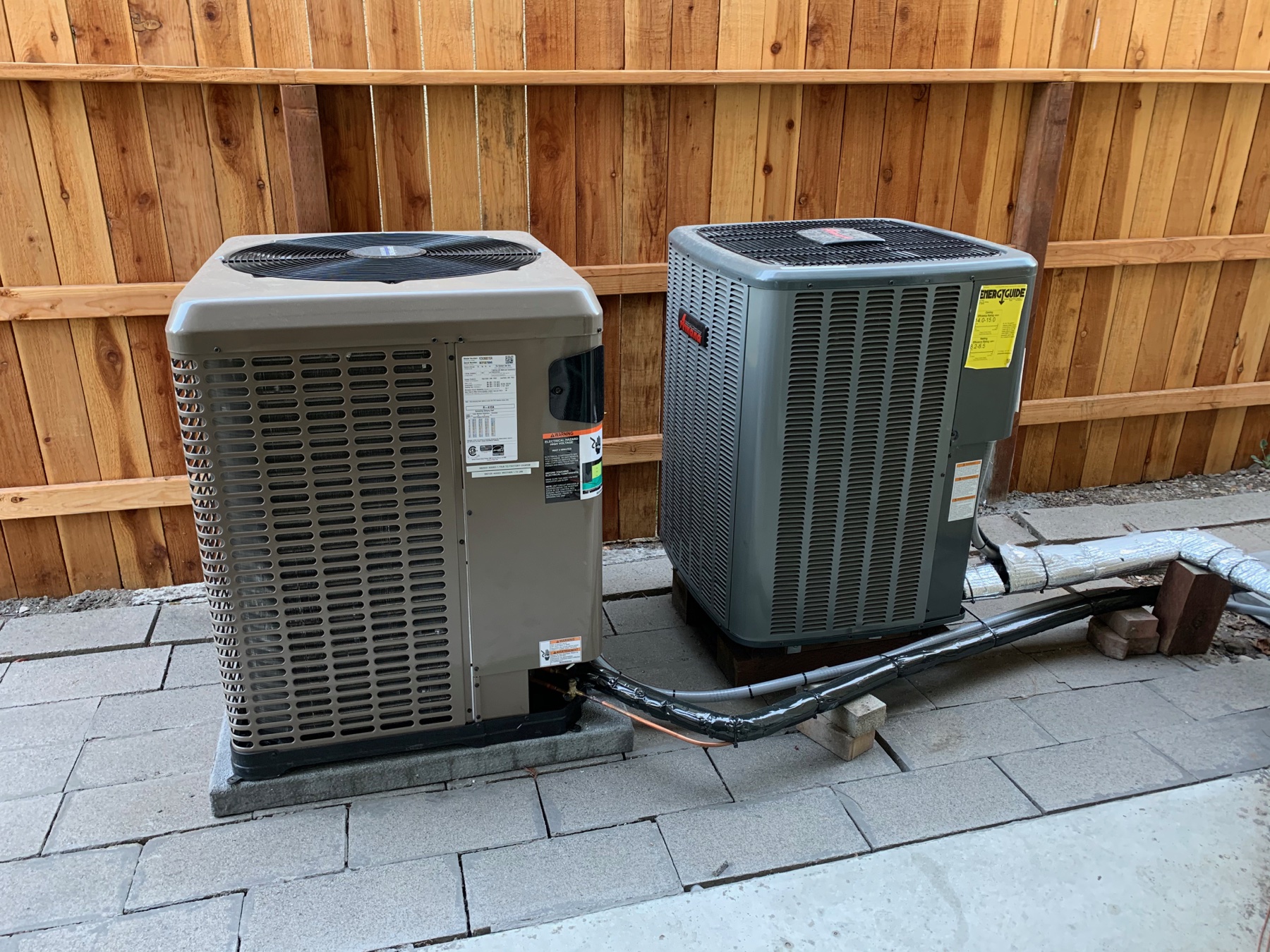 Two completed outdoor heat-pump installations at the Central Valley Research Homes